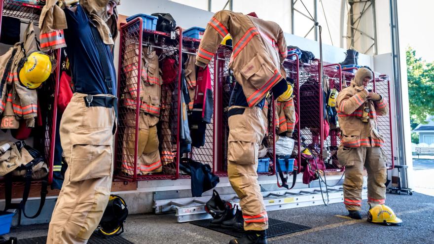 fire fighters putting on turnout gear