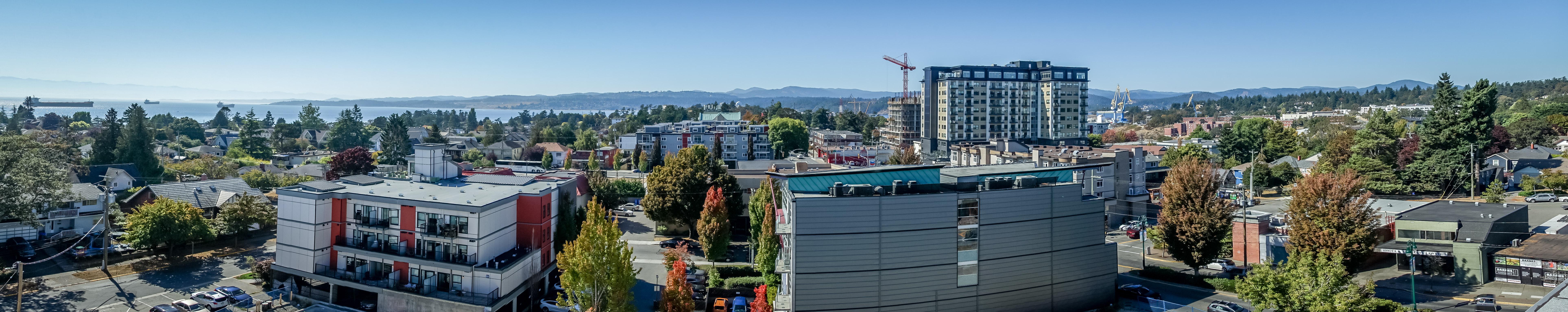Esquimalt buildings with the ocean in the background in a panoramic shot.